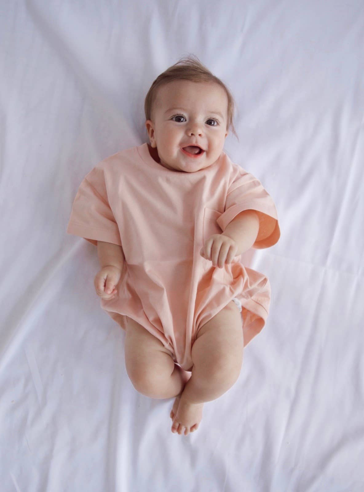 Cory Pocket Romper in Peach Powder