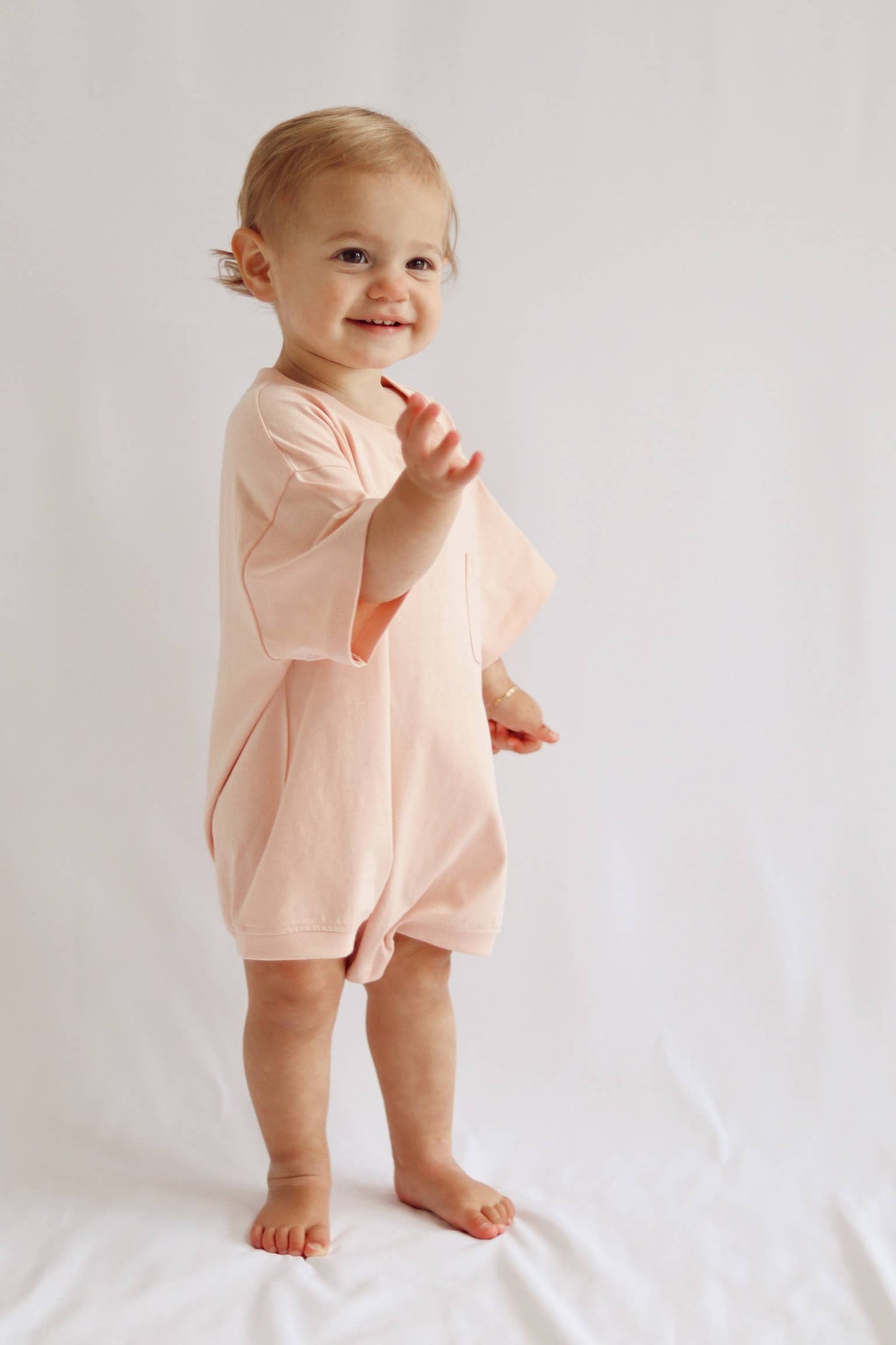 Cory Pocket Romper in Peach Powder
